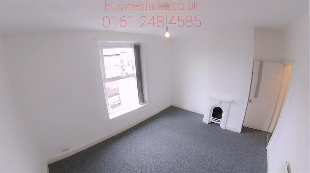 Bright single bedroom with a large window allow...