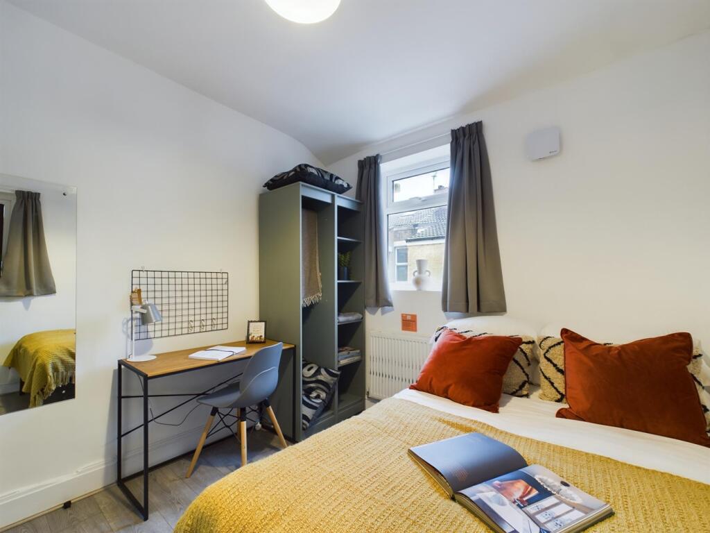 A bright and inviting double bedroom featuring ...