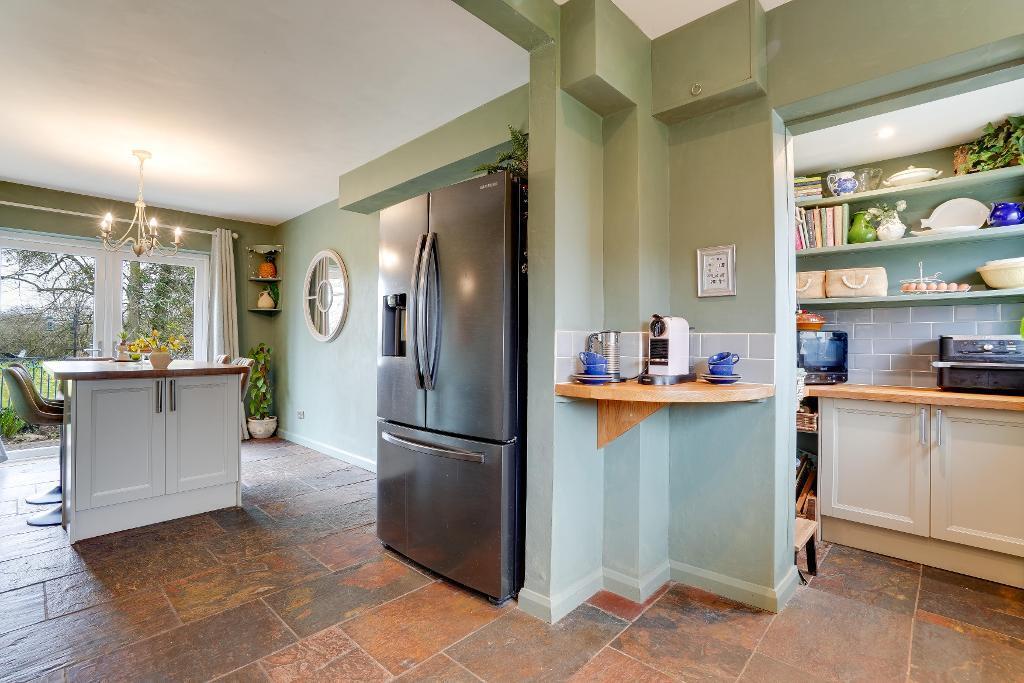 Kitchen with island and larder