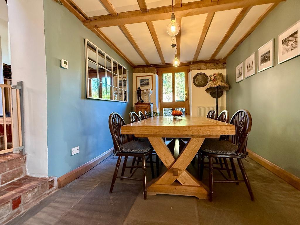 Large dining area opposite the kitchen