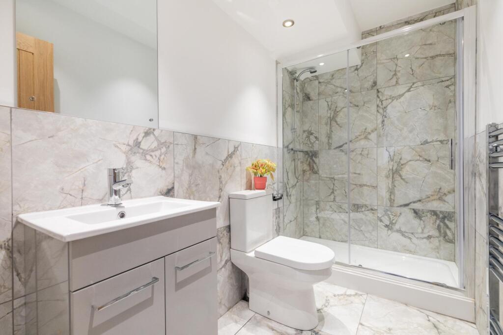 A modern, well-maintained bathroom featuring a ...