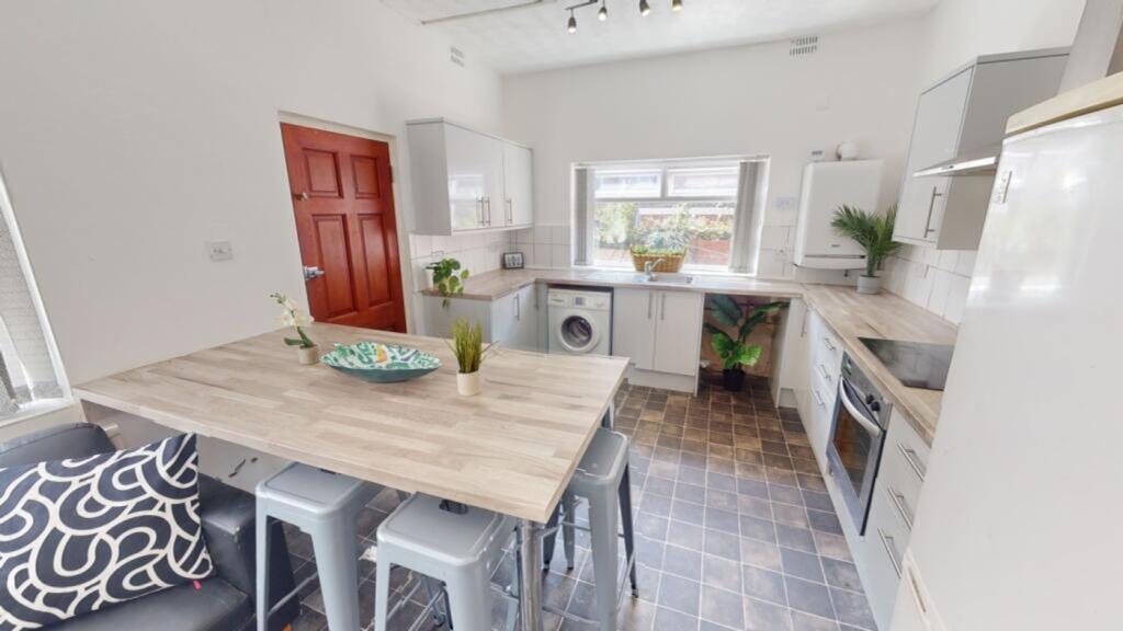A modern and spacious kitchen with ample natura...