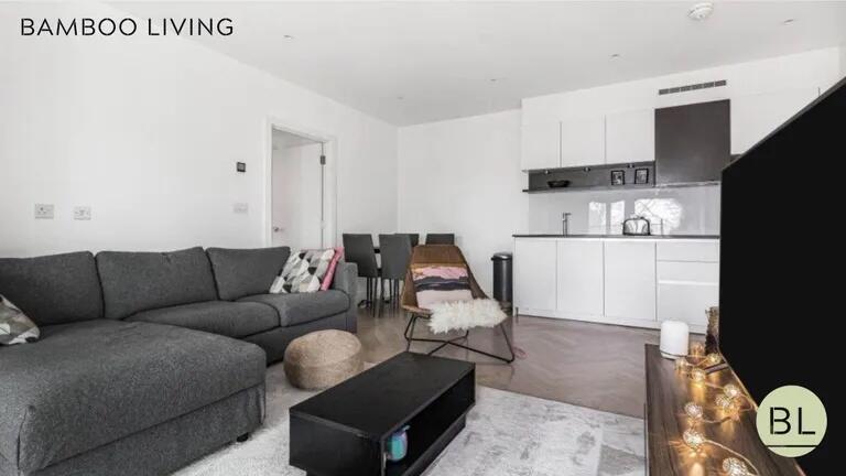 Bright and modern living room featuring a spaci...