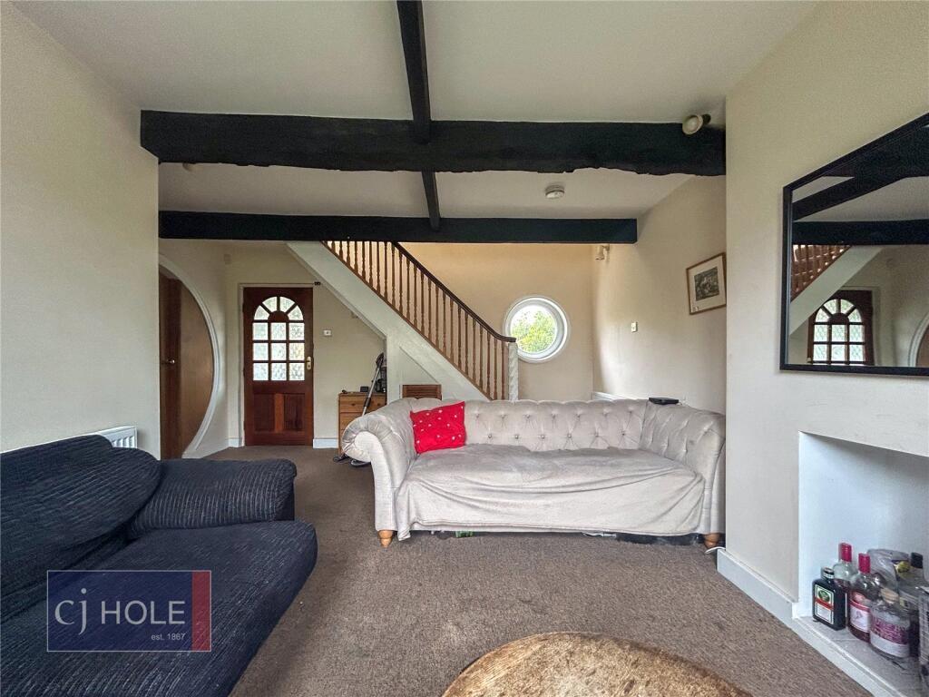 A cozy living room featuring a comfortable sofa...