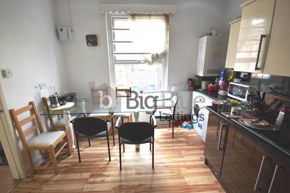 Bright kitchen space featuring contemporary cab...