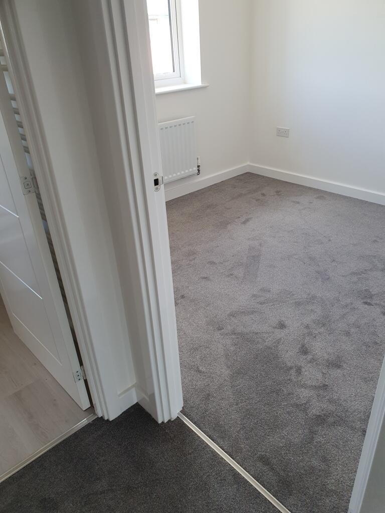 A bright and inviting double bedroom featuring ...