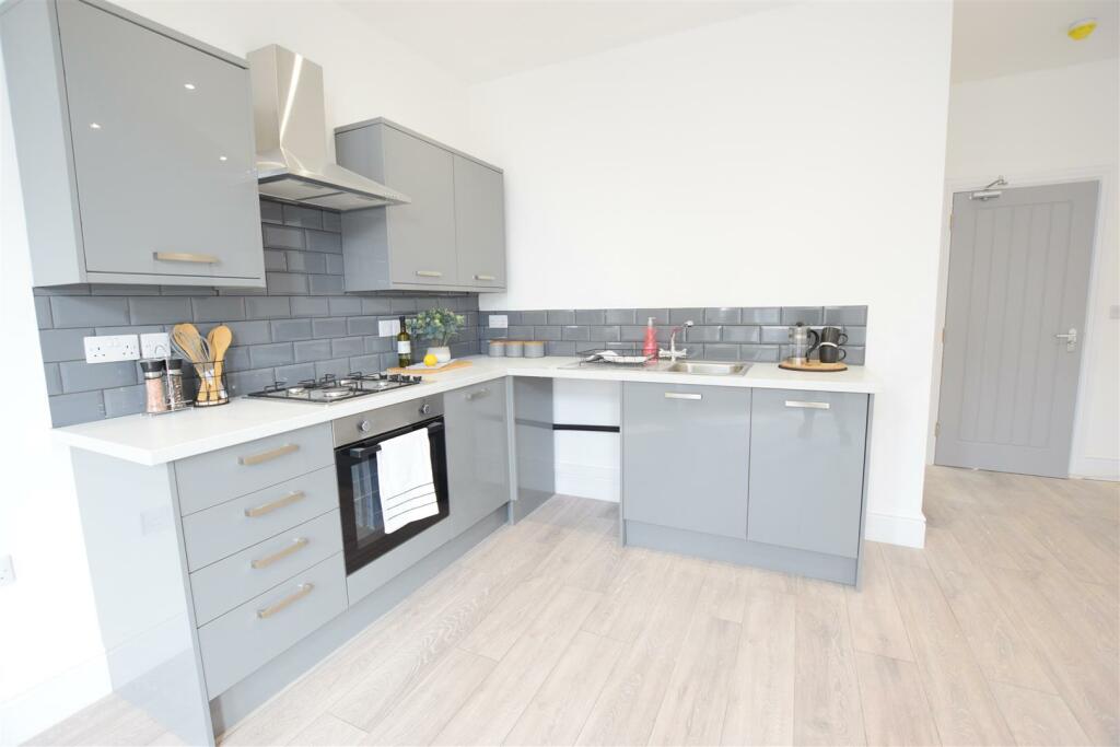 Apt 1 Living Kitchen.JPG