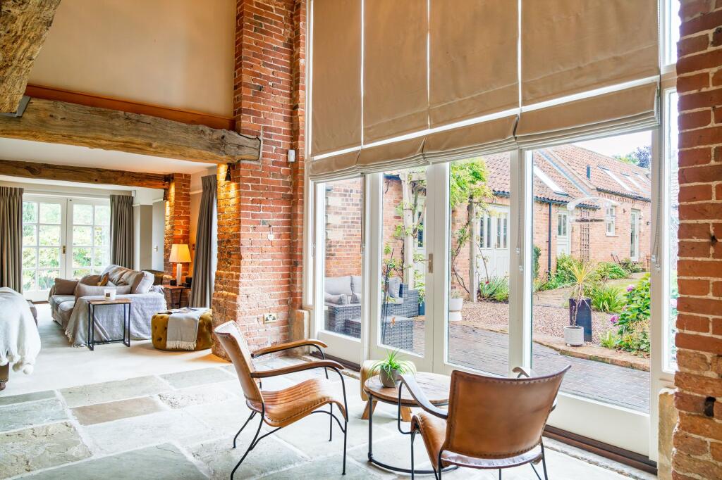 Full height windows onto the courtyard