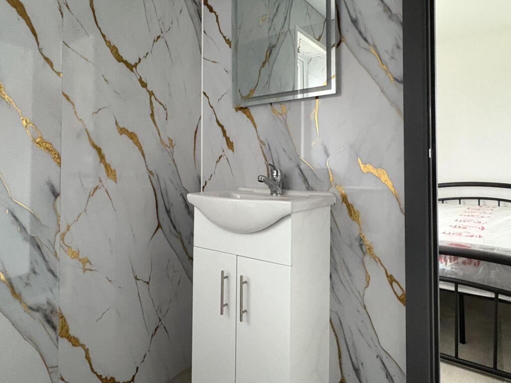 Bright, modern bathroom corner with a stylish w...