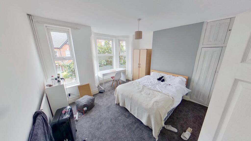 Bright and inviting double bedroom featuring a ...