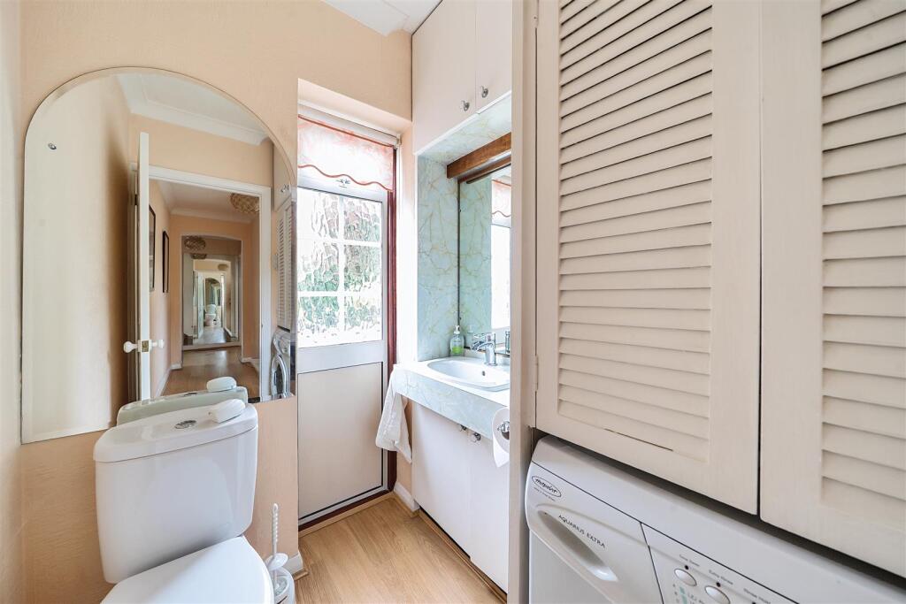 Guest Cloakroom/Utility Room: