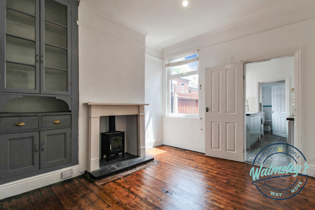Rear sitting room with built in storage &amp; log burn