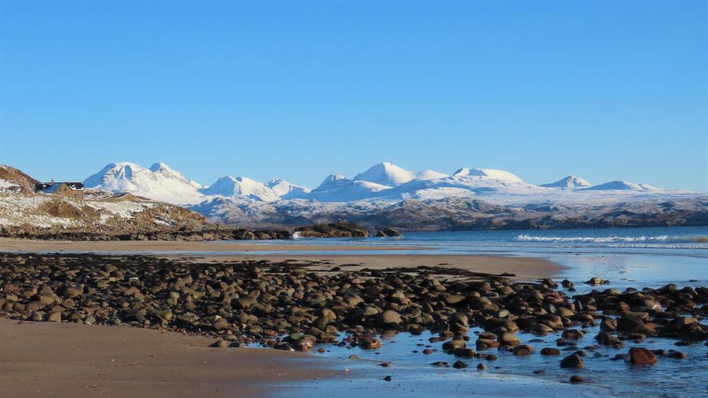 Snowy Torridon mountains from Big Sand Beach.JPG