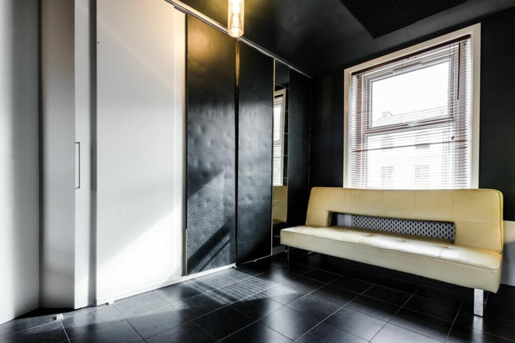 A stylish and well-lit hallway featuring modern...