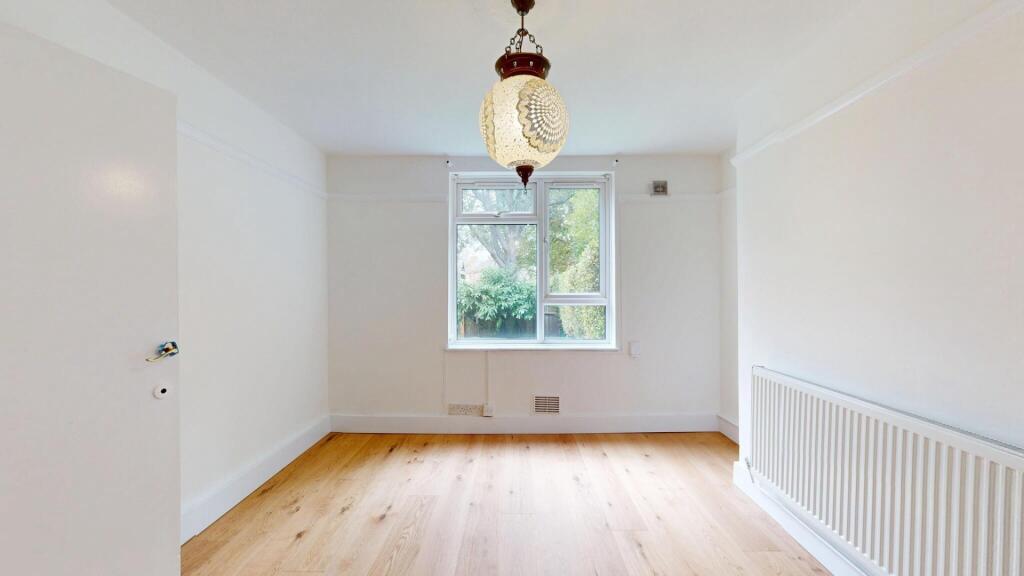 Bright and spacious living room with a large wi...