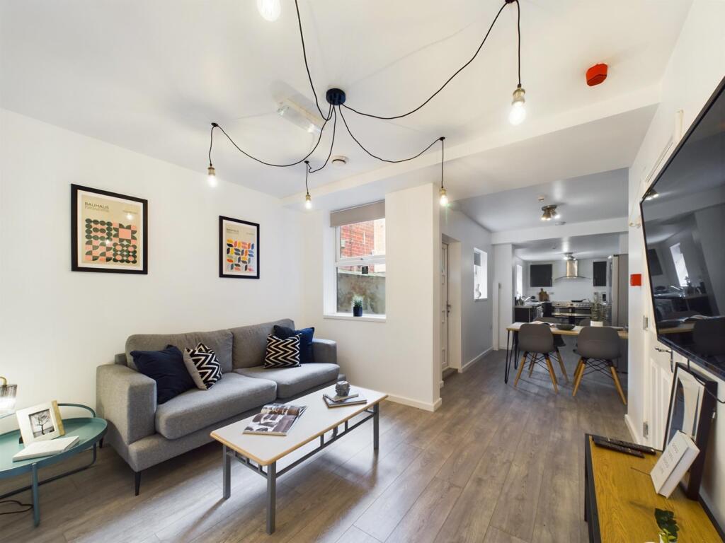 A stylish and spacious modern living room perfe...