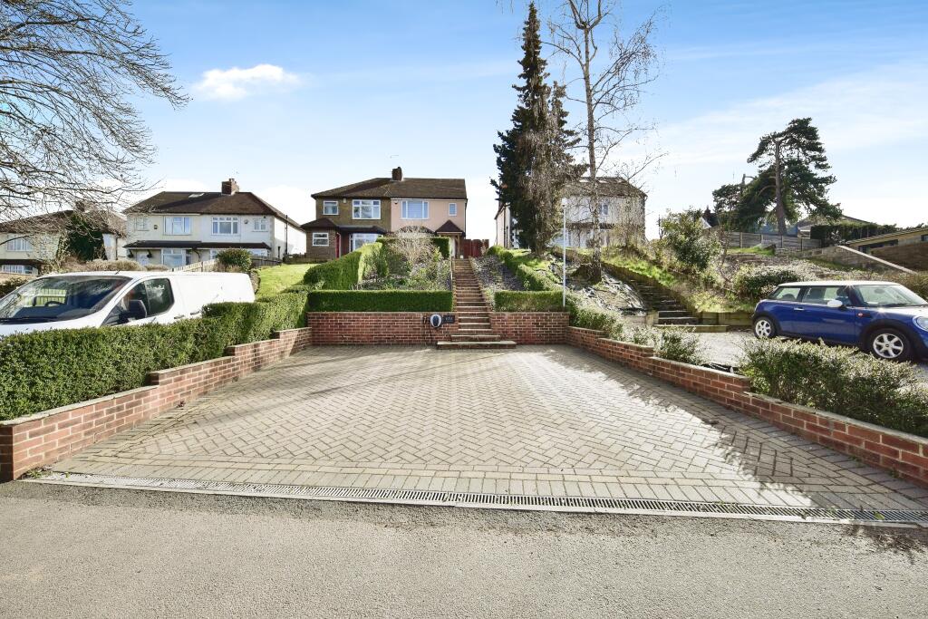Front View Of The Property With Driveway Parking