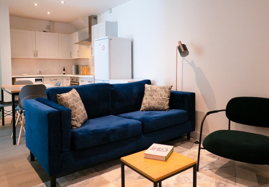 A stylish and spacious modern living room ideal...