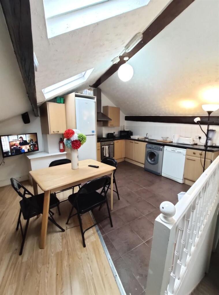 Bright and functional kitchen with modern appli...