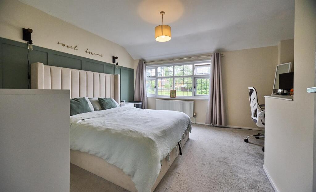 BEDROOM ONE TO FRONT