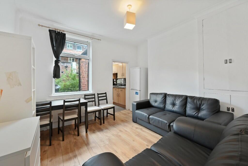 Bright and inviting living room featuring comfo...