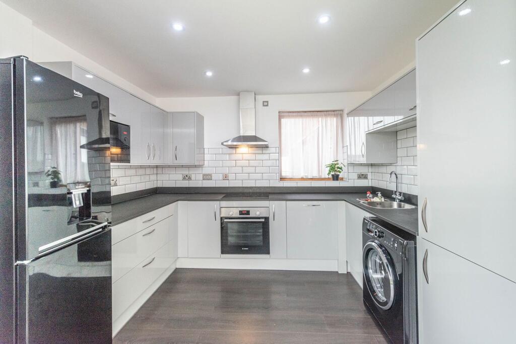 SITTING/DINING ROOM AND FITTED KITCHEN