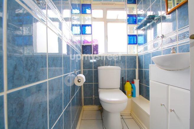 A compact, clean bathroom featuring a modern to...
