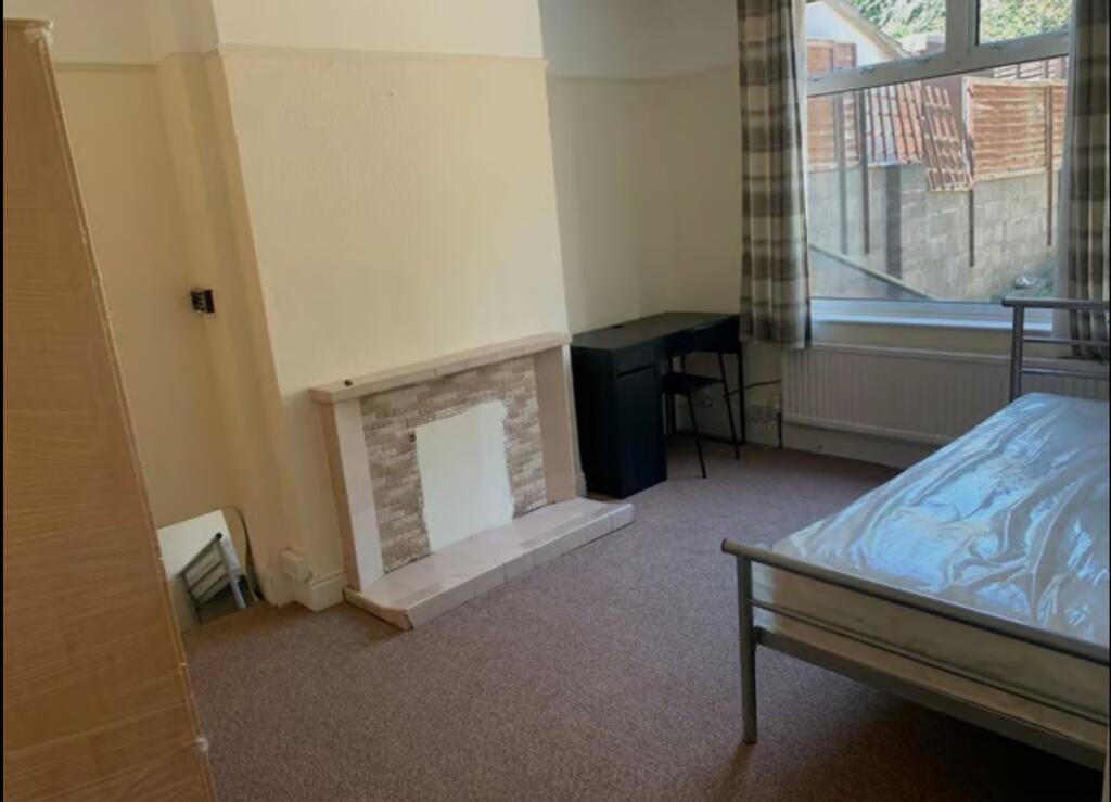 A bright and spacious double bedroom featuring ...