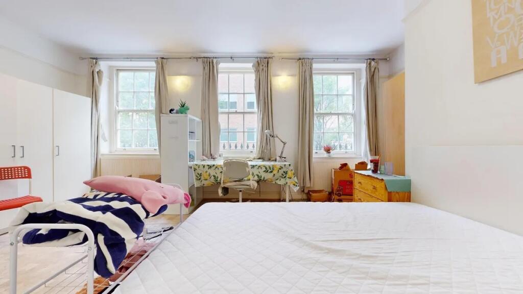 Bright and airy double bedroom featuring three ...