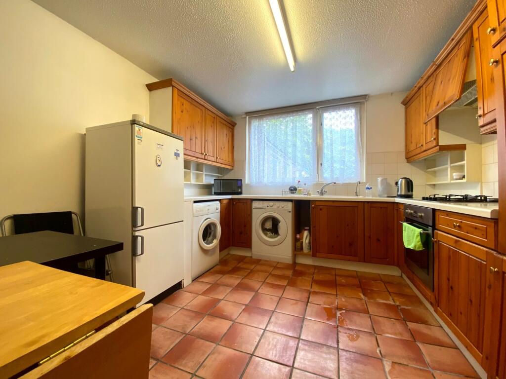 A spacious and functional kitchen with ample na...