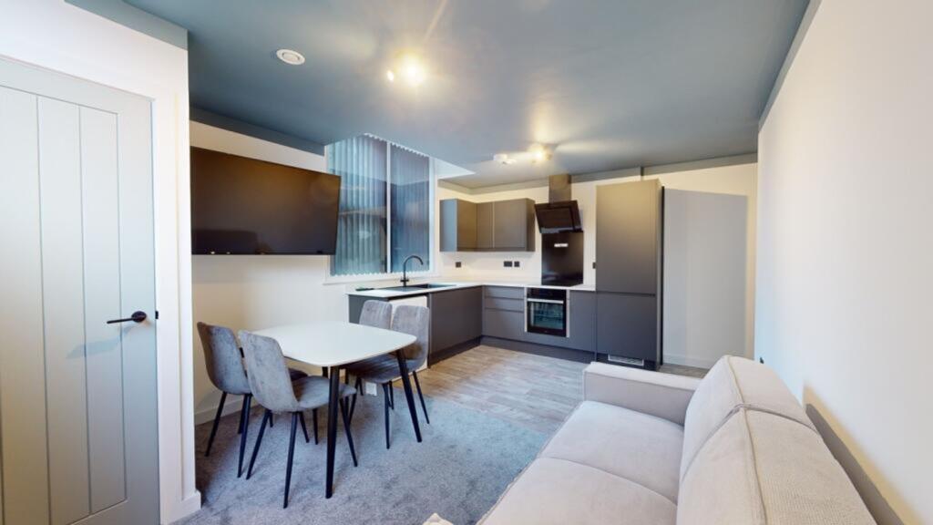 A modern and inviting kitchenette with sleek ap...