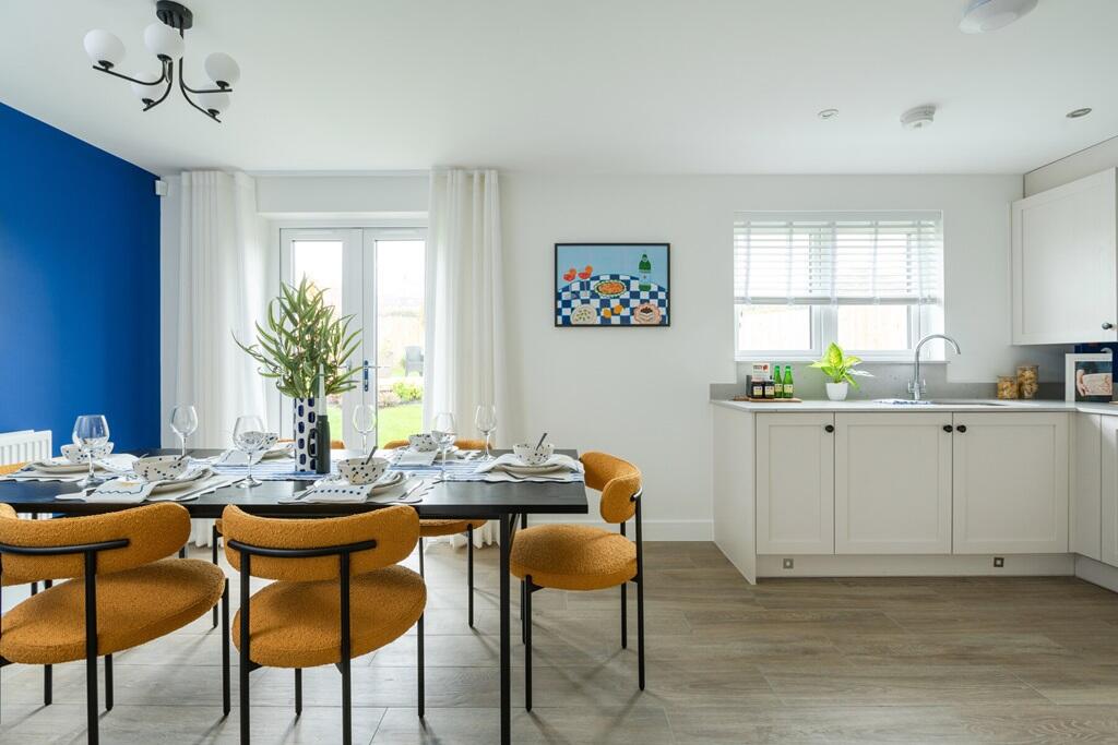 The kitchen diner is flooded with natural light