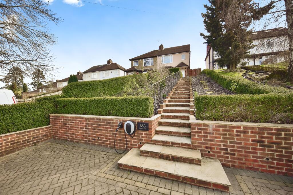 Outside View Of The Property With Driveway Parking