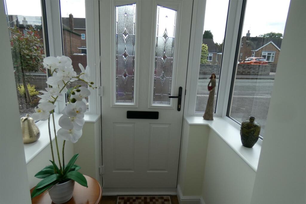 ENCLOSED FRONT PORCH