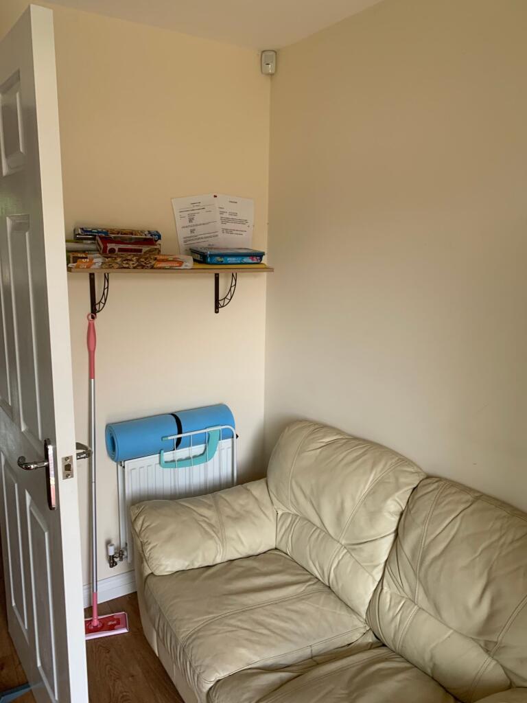 A cozy communal lounge area featuring a comfort...