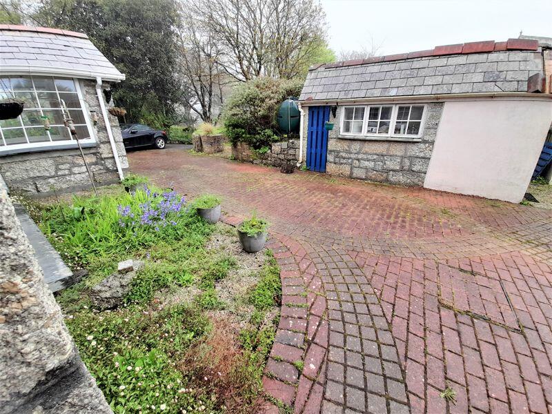 Paved Courtyard with Stone Building