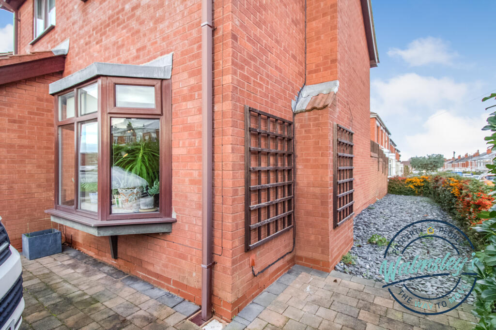 Side of house beyond hedging