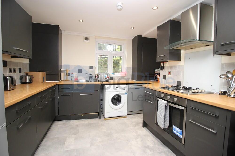 Bright and modern kitchen featuring ample count...