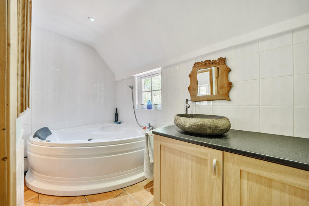 Downstairs bathroom with bath and separate shower cubicle