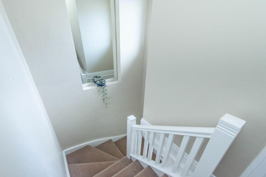 ENTRANCE HALLWAY AND STAIRWAY