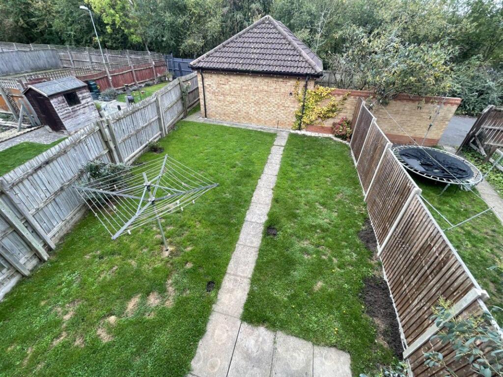 Rear Garden showing Garage
