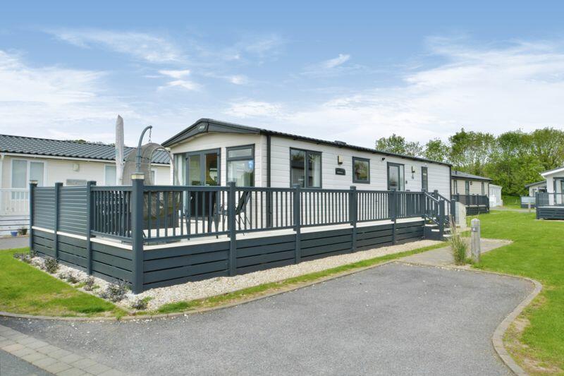 Detached lodge with parking