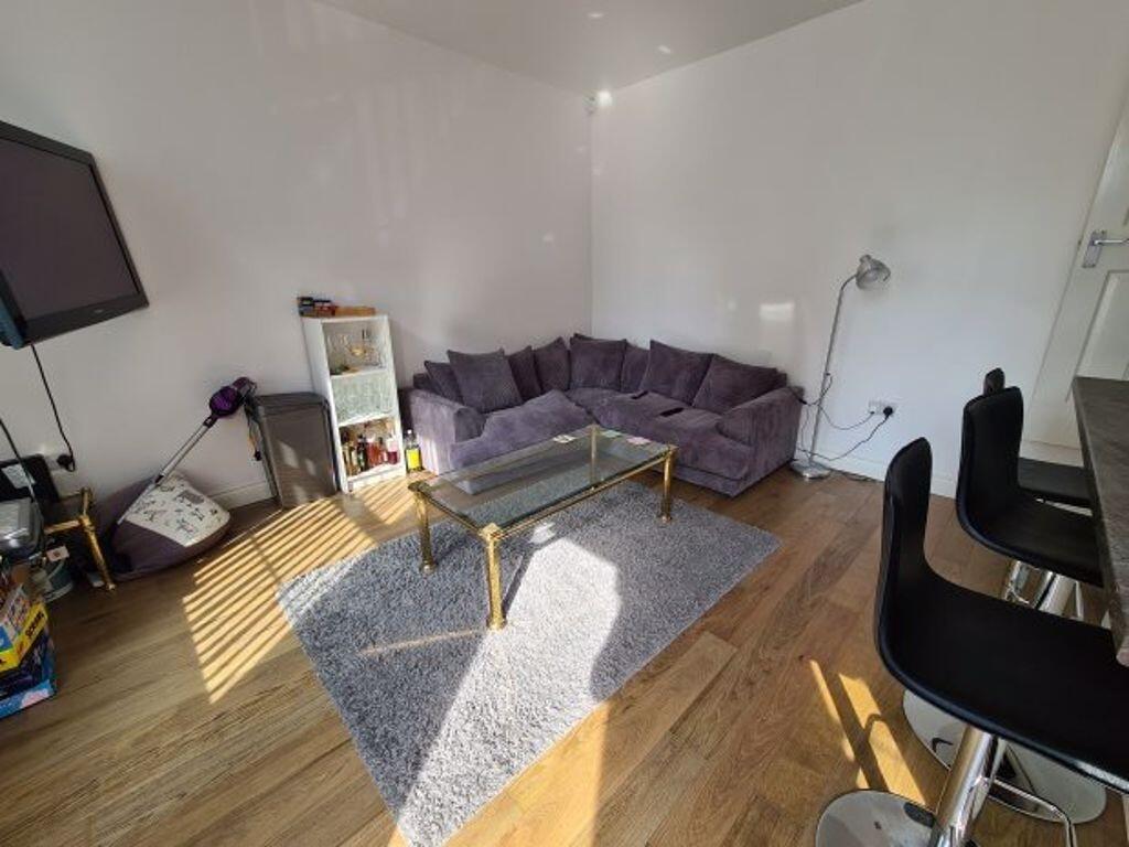 Bright and welcoming living room featuring a co...