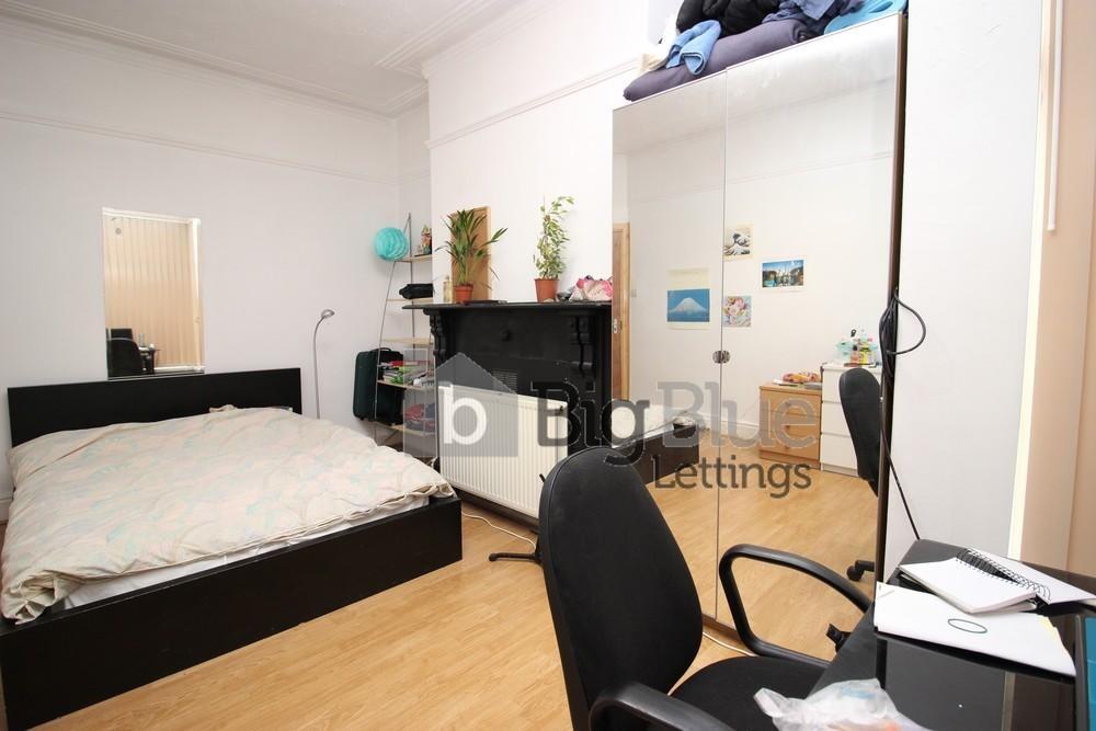 Bright and spacious master bedroom featuring a ...