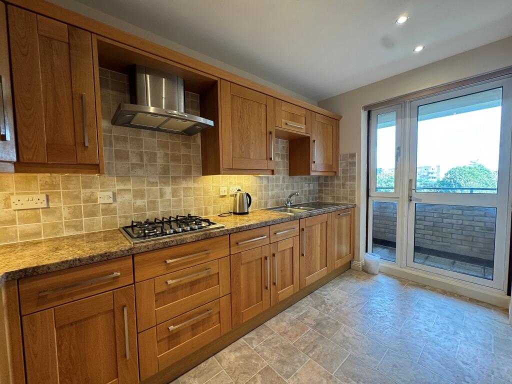 kitchen showing balcony door