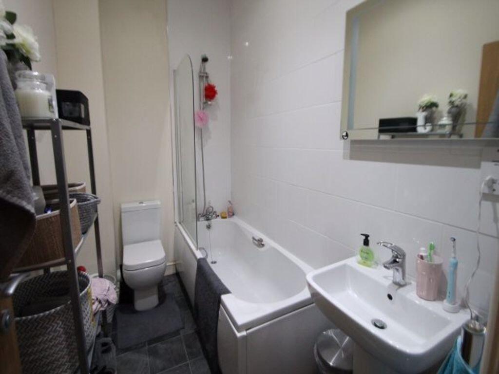 A clean and well-maintained bathroom featuring ...