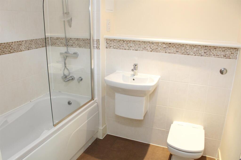 Bathroom with shower over bath