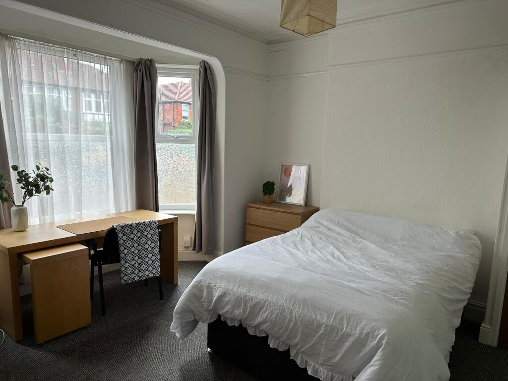 Bright and inviting double bedroom featuring a ...