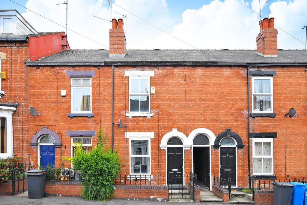 A charming terraced brick house featuring class...