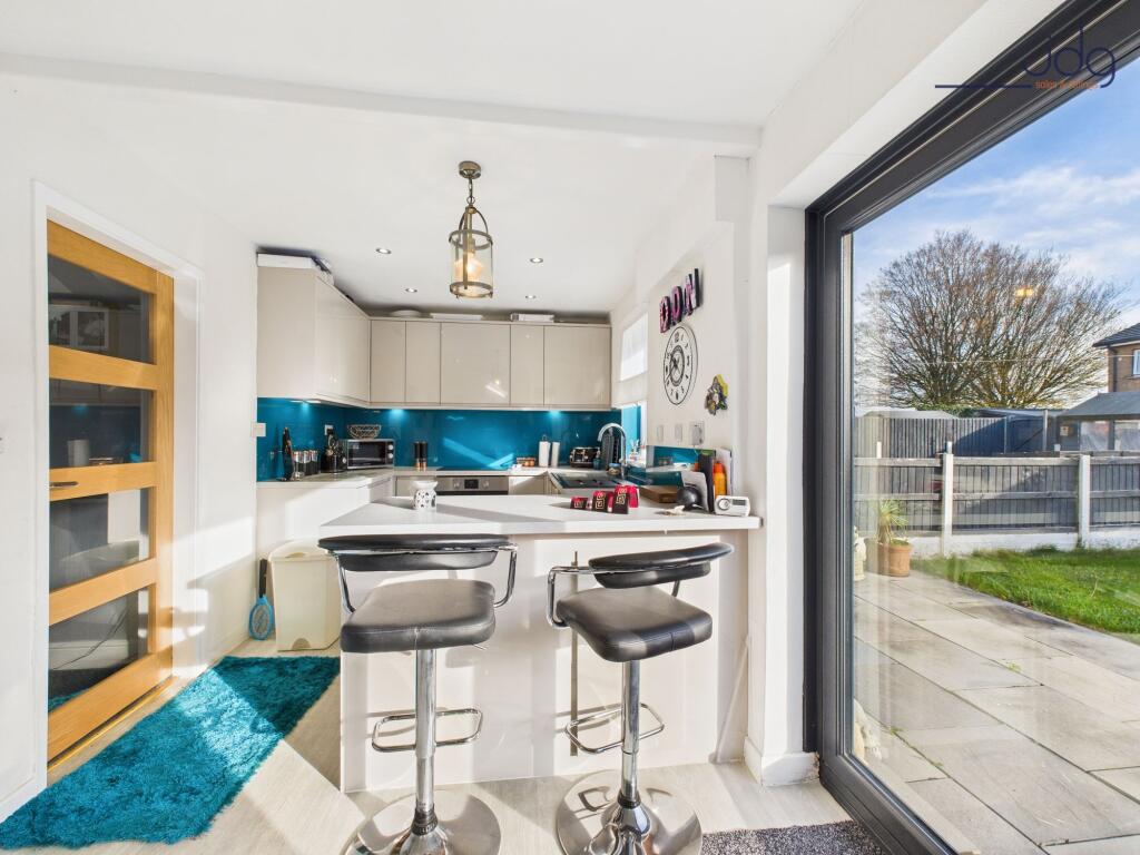 Open Plan Kitchen Diner with Breakfast Bar and bi-folding doors